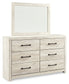 Cambeck King Upholstered Panel Bed with Mirrored Dresser and Chest