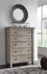 Harrastone King Panel Bed with Mirrored Dresser, Chest and 2 Nightstands